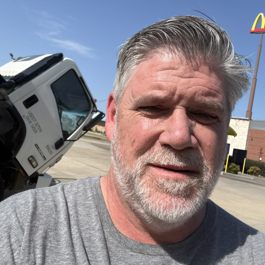 Selfie of Lee Sonnenberg waiting for repairs in front of the Penske truck